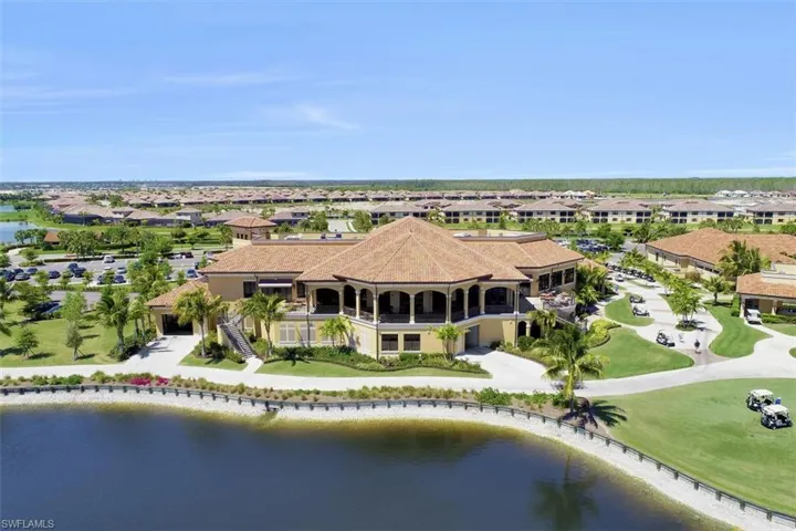 Rear of Clubhouse featuring outdoor seating and fabulous view.