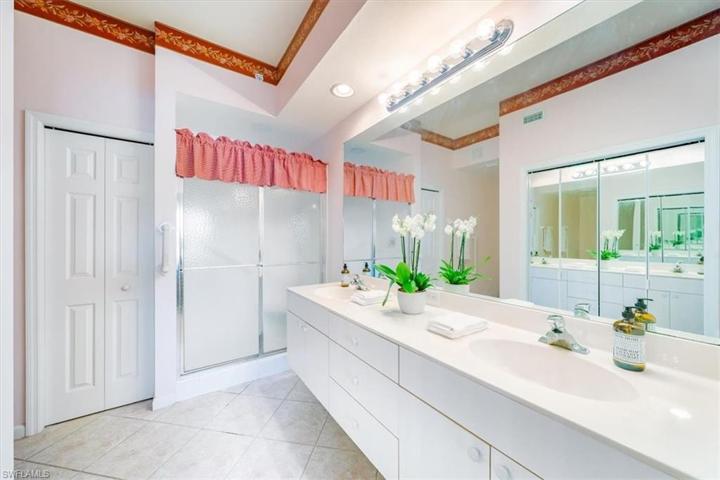 Primary bathroom features a walk-in and linen closet