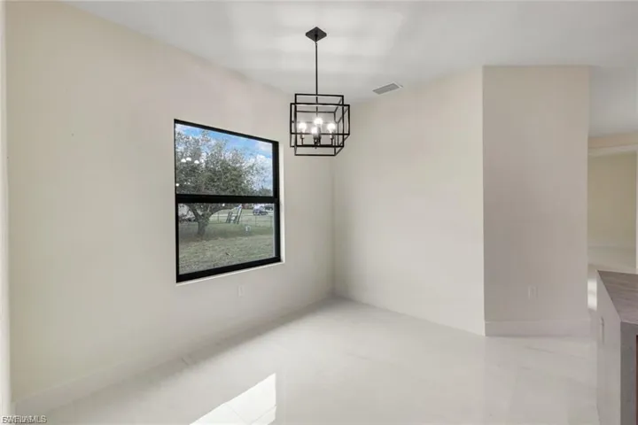 This dining area provides a bright, open space for meals and gatherings, featuring plenty of natural light and a well-designed layout, perfect for both everyday dining and entertaining.