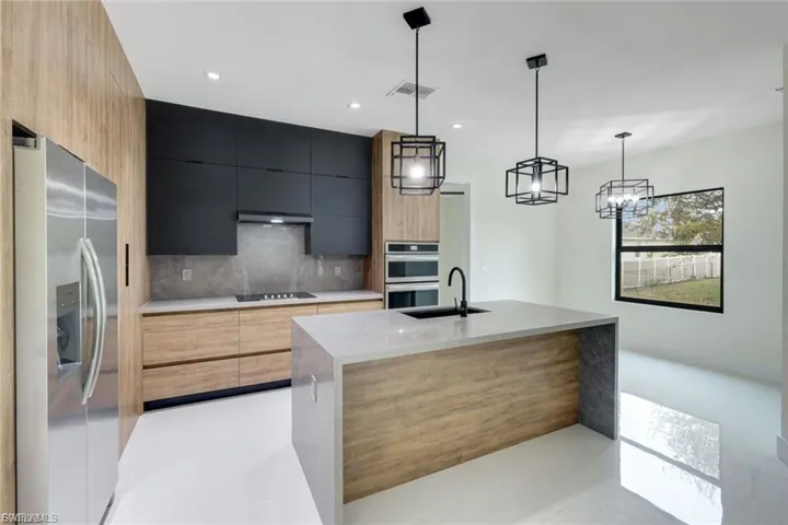 This kitchen flows smoothly into the dining area, creating the perfect space for family meals or entertaining guests, ideal for both casual dining and formal gatherings.
