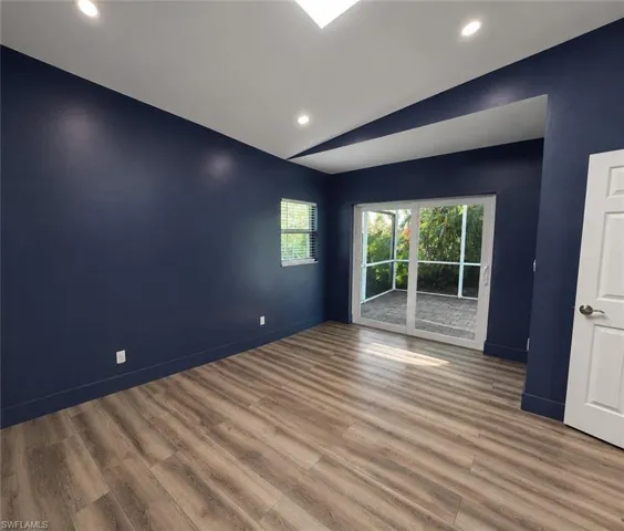 Recessed ceiling lighting, wood-finish flooring, sliding glass doors, screened patio, white interior door