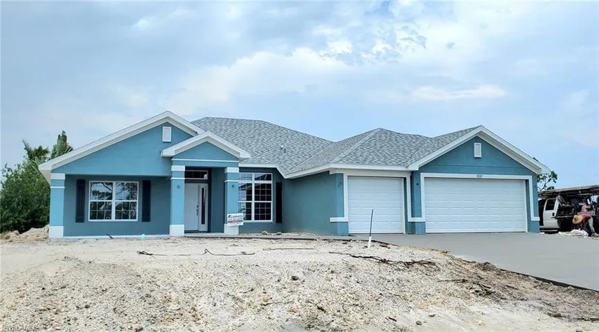 View of front of property featuring a garage