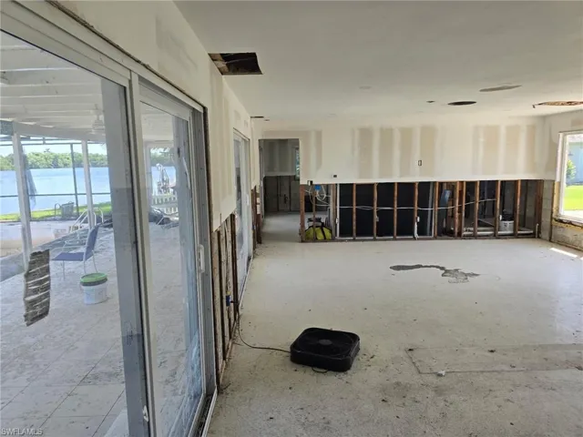 Empty room featuring a water view