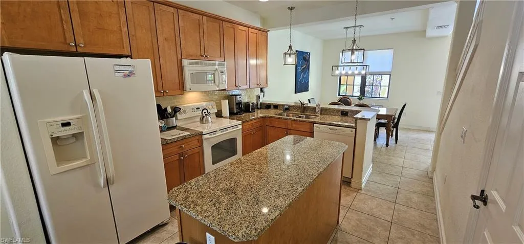 Full bathroom with a bath, double vanity, a stall shower, and tile patterned floors