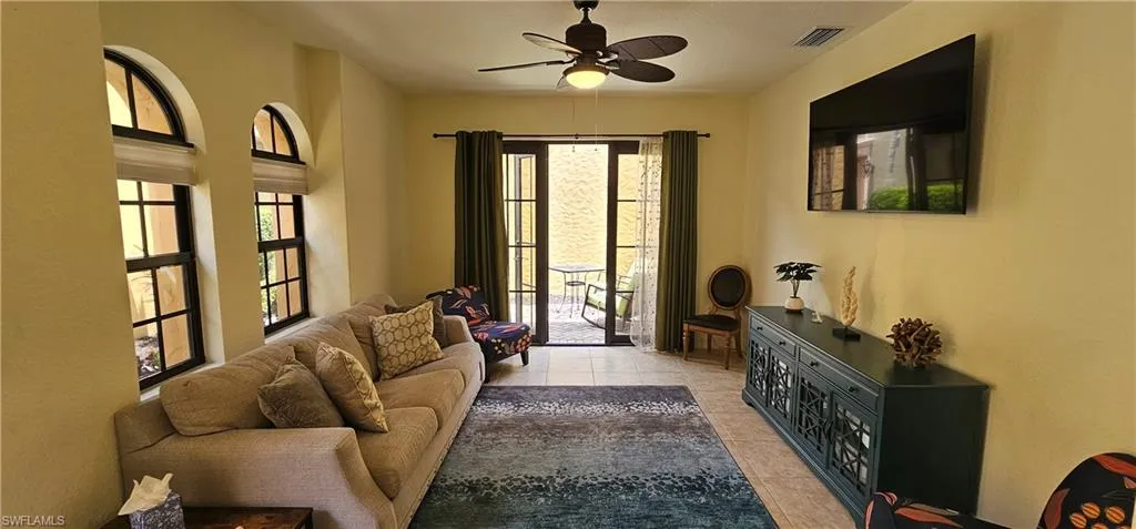 Dining space with light tile patterned floors and baseboards
