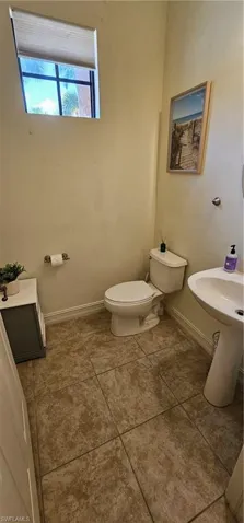 Ensuite bathroom featuring toilet and double vanity