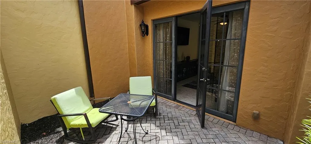 Community pool featuring a patio