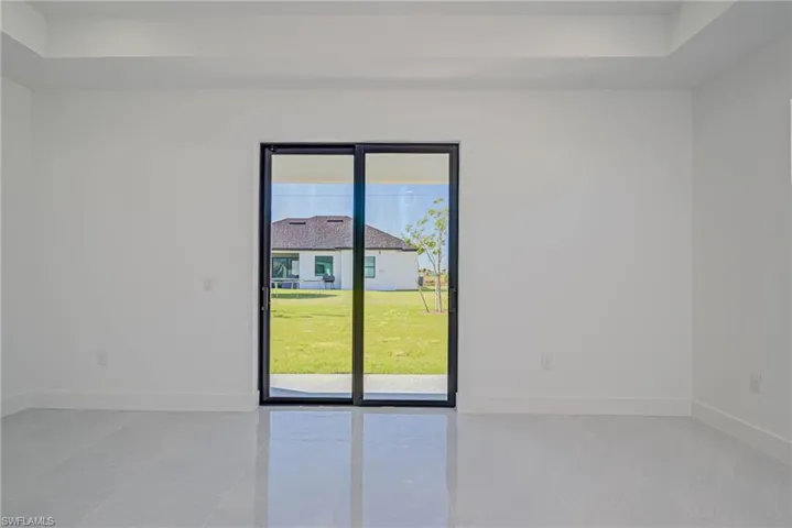 Empty room featuring baseboards