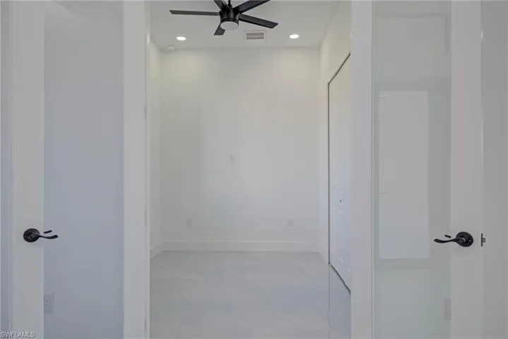 Spare room with visible vents, recessed lighting, baseboards, and a ceiling fan