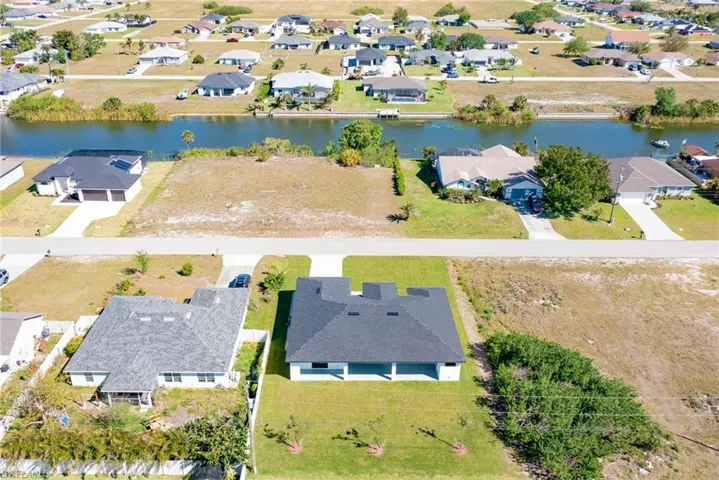 Aerial view with a residential view and a water view