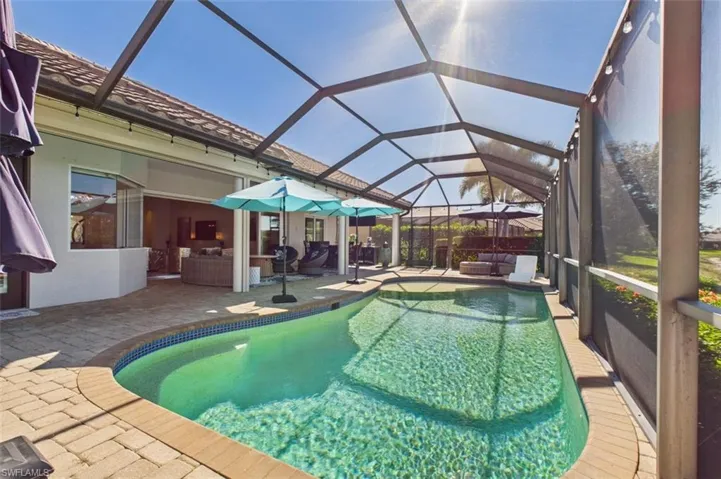 pool looking towards the left of the home and covered lanai area