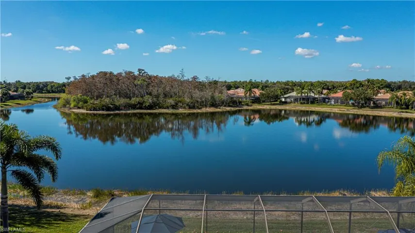 aerial View from back of home with wide water view and view of preserve and golf course