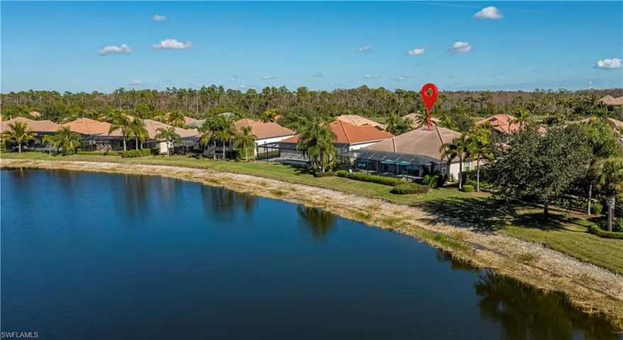 drone of the back of the home looking from the wide lake view