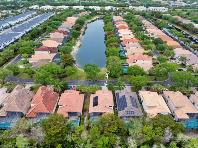 Birds eye view of property featuring a residential view and a water view from front of home.