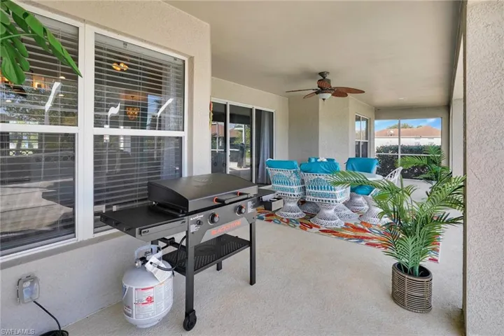 View of patio featuring a ceiling fan