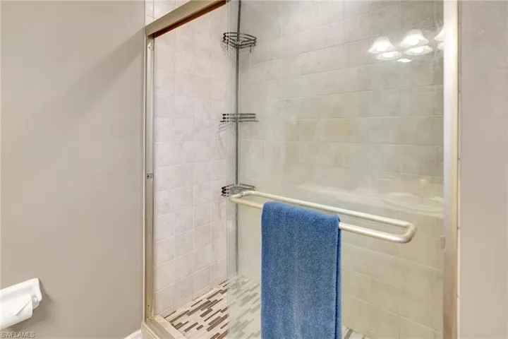 Bathroom featuring a shower stall