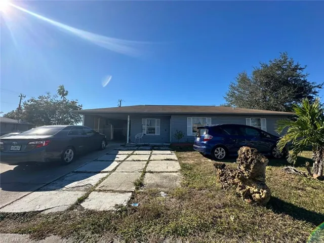 View of front of house featuring a carport