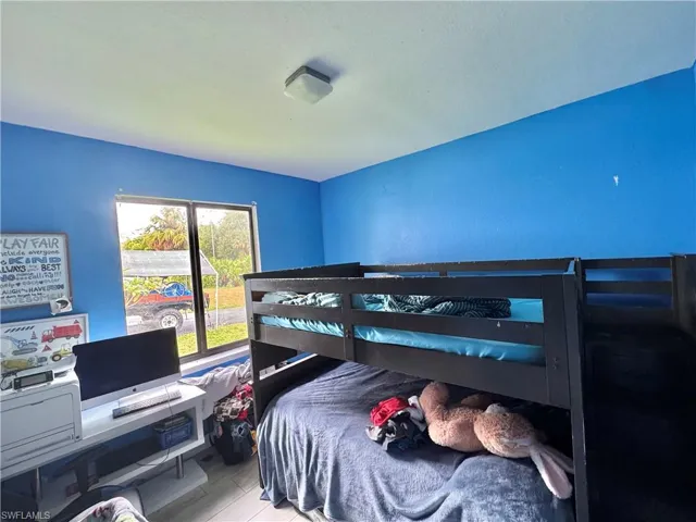 Bedroom with wood finished floors