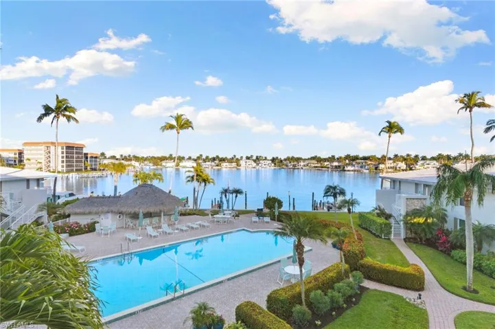 Lovely outdoor pool on bay with outdoor bar, tiki hut