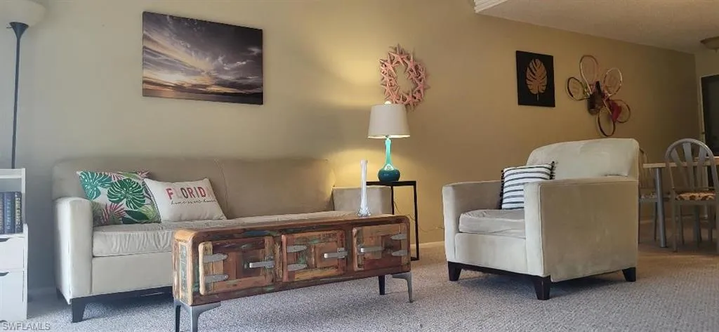 Living area with carpet flooring