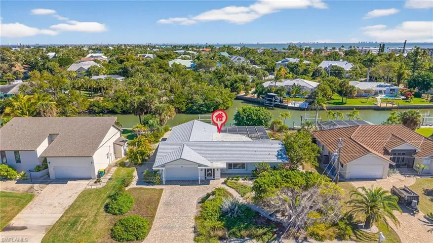 Aerial view of residential area with a nearby body of water