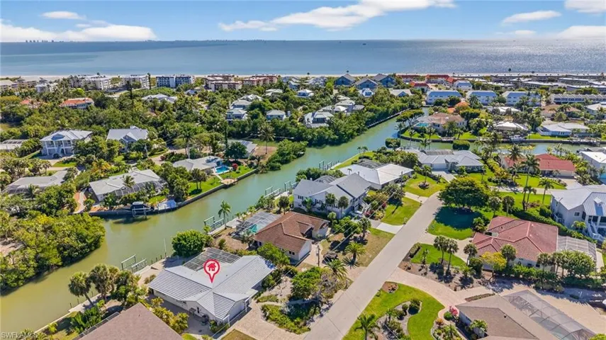 Aerial view of residential area with a nearby body of water