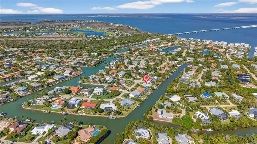 Aerial overview of property's location featuring nearby suburban area