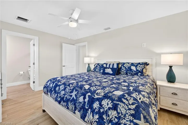 Bedroom with light wood-style flooring and ceiling fan