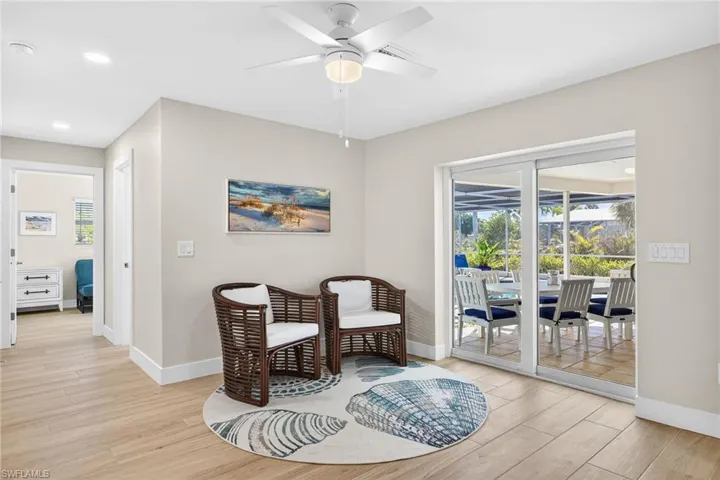 Family room featuring light wood-type flooring, ceiling fan, and recessed lighting