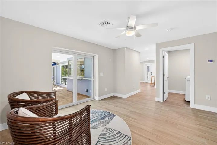 Family room featuring light wood-type flooring and a ceiling fan