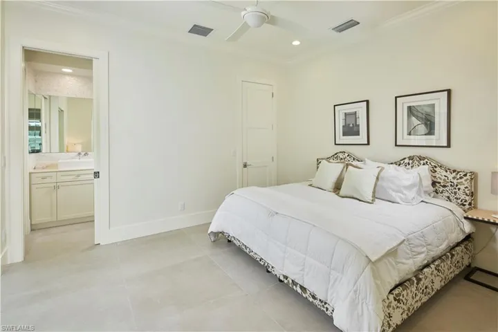 En suite guest bedroom tucked privately away from the primary bedroom and great room.