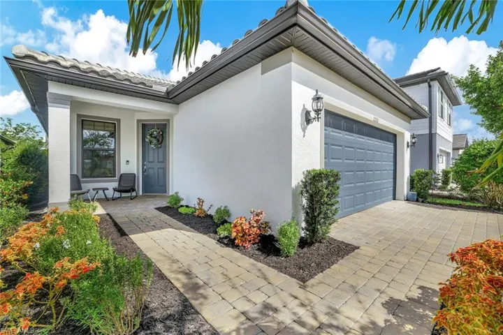 Doorway to property with a garage