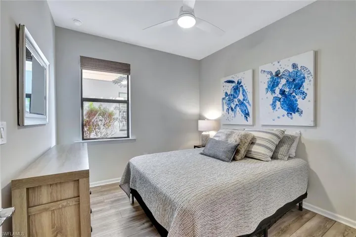 Bedroom featuring light wood-type flooring and ceiling fan