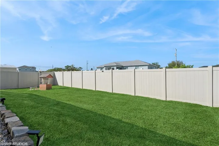 View of yard with a fenced backyard