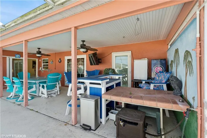 View of patio featuring outdoor dining space and a ceiling fan