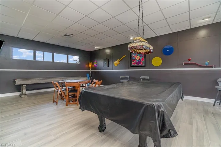 Vintage style billiards room includes poker table too