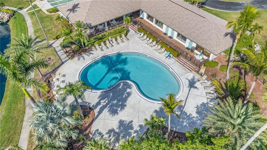 View of subject property featuring a pool