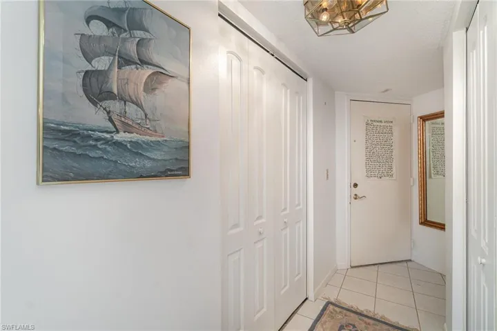 Foyer is cleverly configured to include utility and storage closets