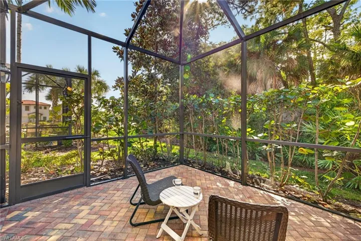 Patio/screened lanai with peaceful preserve view.