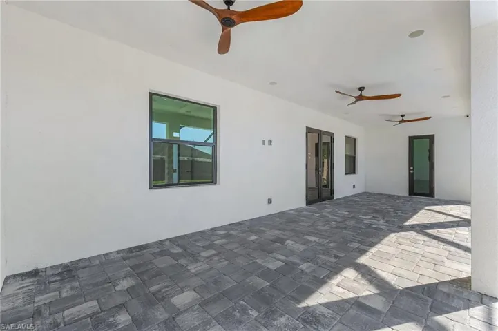 View of patio featuring ceiling fan