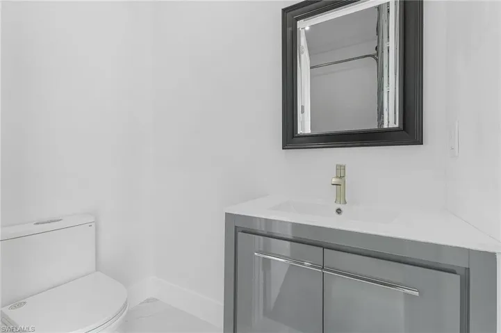Bathroom featuring toilet and vanity