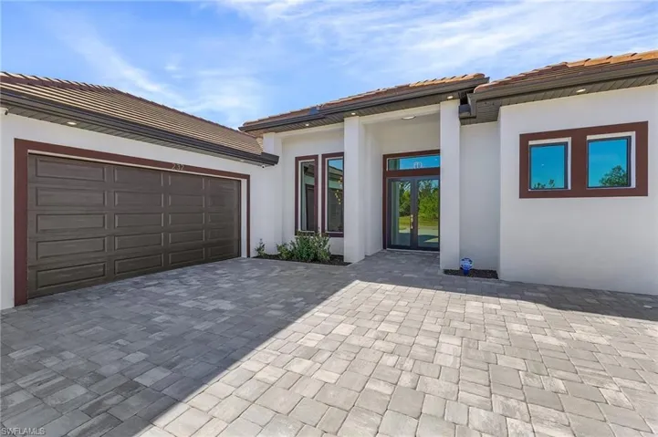 View of front of property featuring a garage