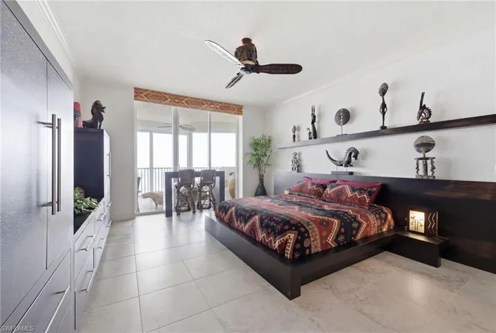 The expansive primary suite offers a spacious and serene retreat, featuring generous proportions, private access to the lanai, and a luxurious ensuite bath designed for comfort and relaxation.