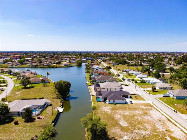 View of lot (right foreground) and canal looking to the west.