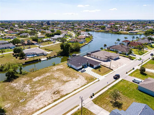 Aerial view looking to the southwest with lot in bottom left.