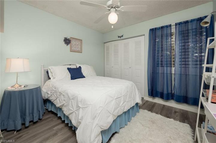 2ND BEDROOM WITH VIEW OF SERINE BACK YARD