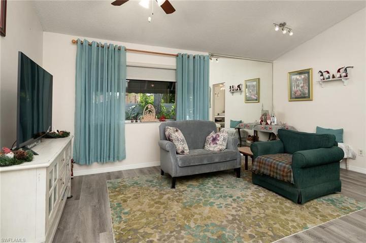 LIVING ROOM ON THE BACK OF THE HOME, OPEN TO THE KITCHEN