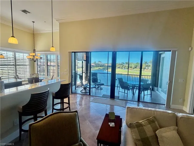 Grand Room with Four Stackable High Impact Doors Overlooking Long Lake View