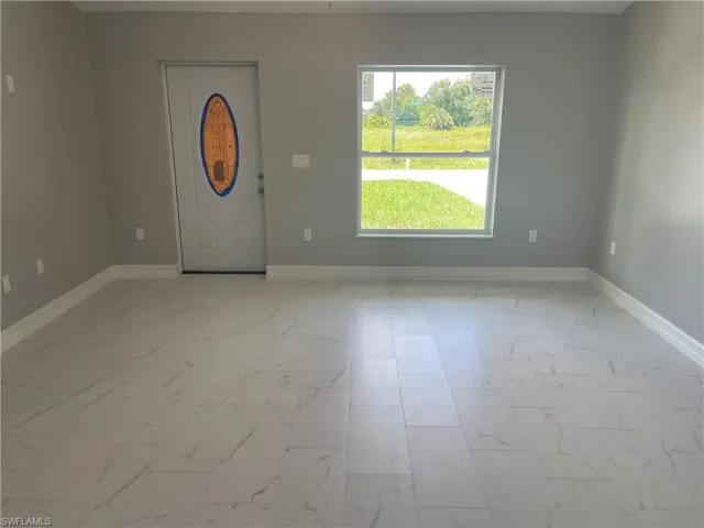 Entrance foyer featuring baseboards