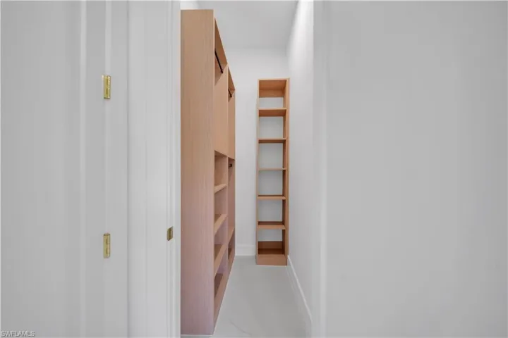 Built-in wood-finish shelving and storage cabinetry